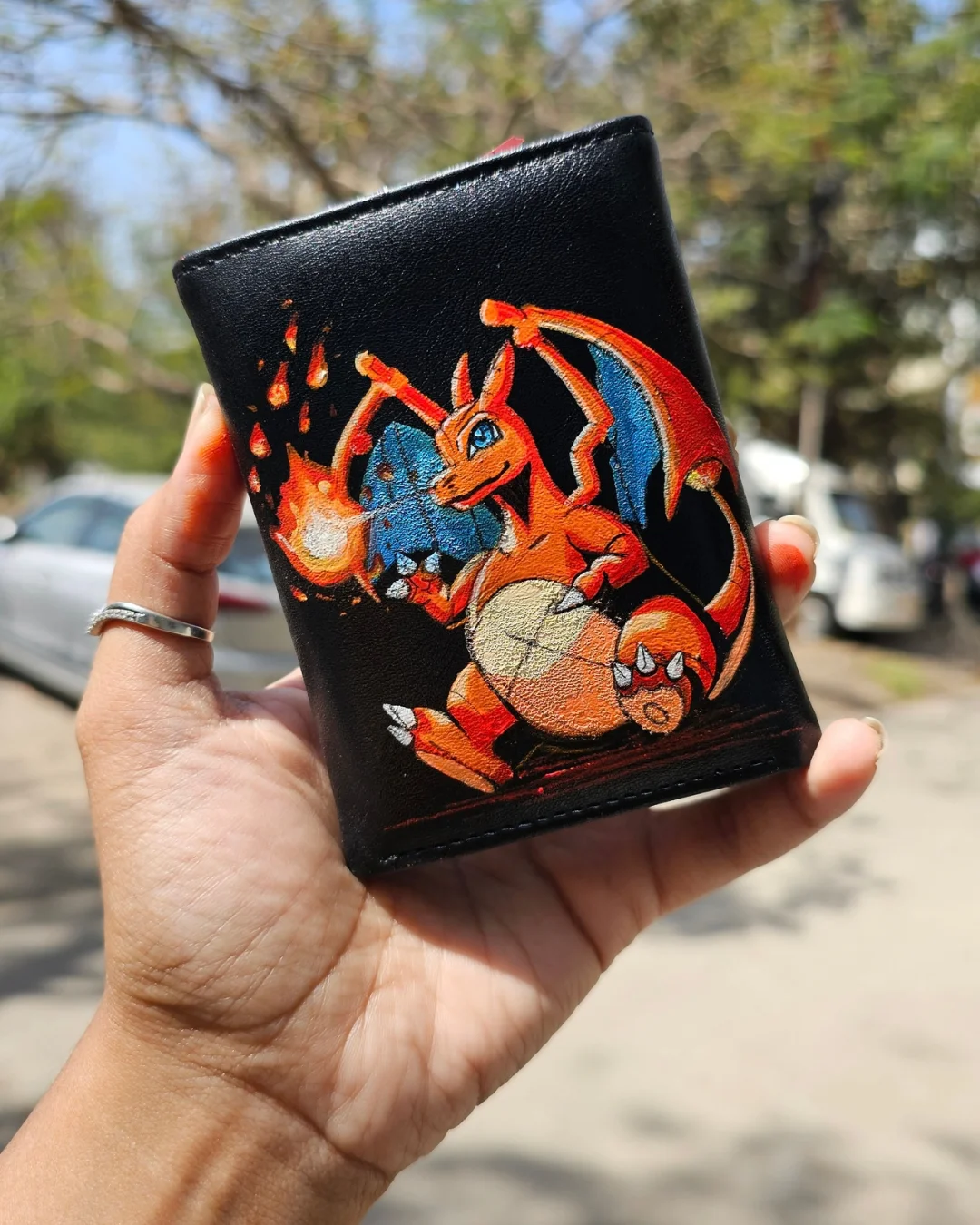 charizard painting on wallet
